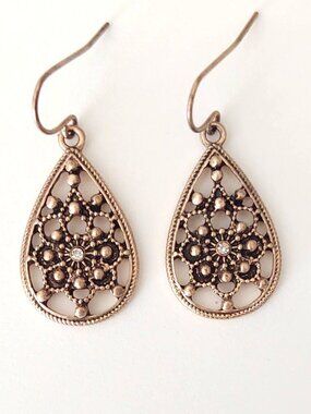 Delicate open design teardrop shaped earrings with cz accents